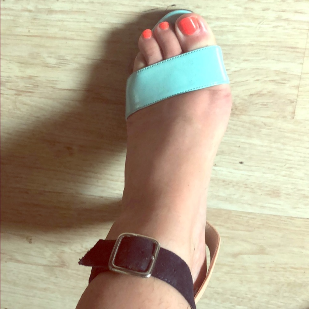 Teal heels with black buckle. Size 7